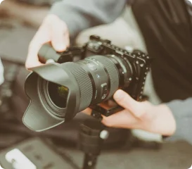 Photographer adjusting camera